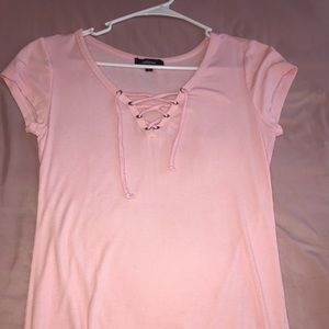 Pink short sleeve shirt with a crossed neck